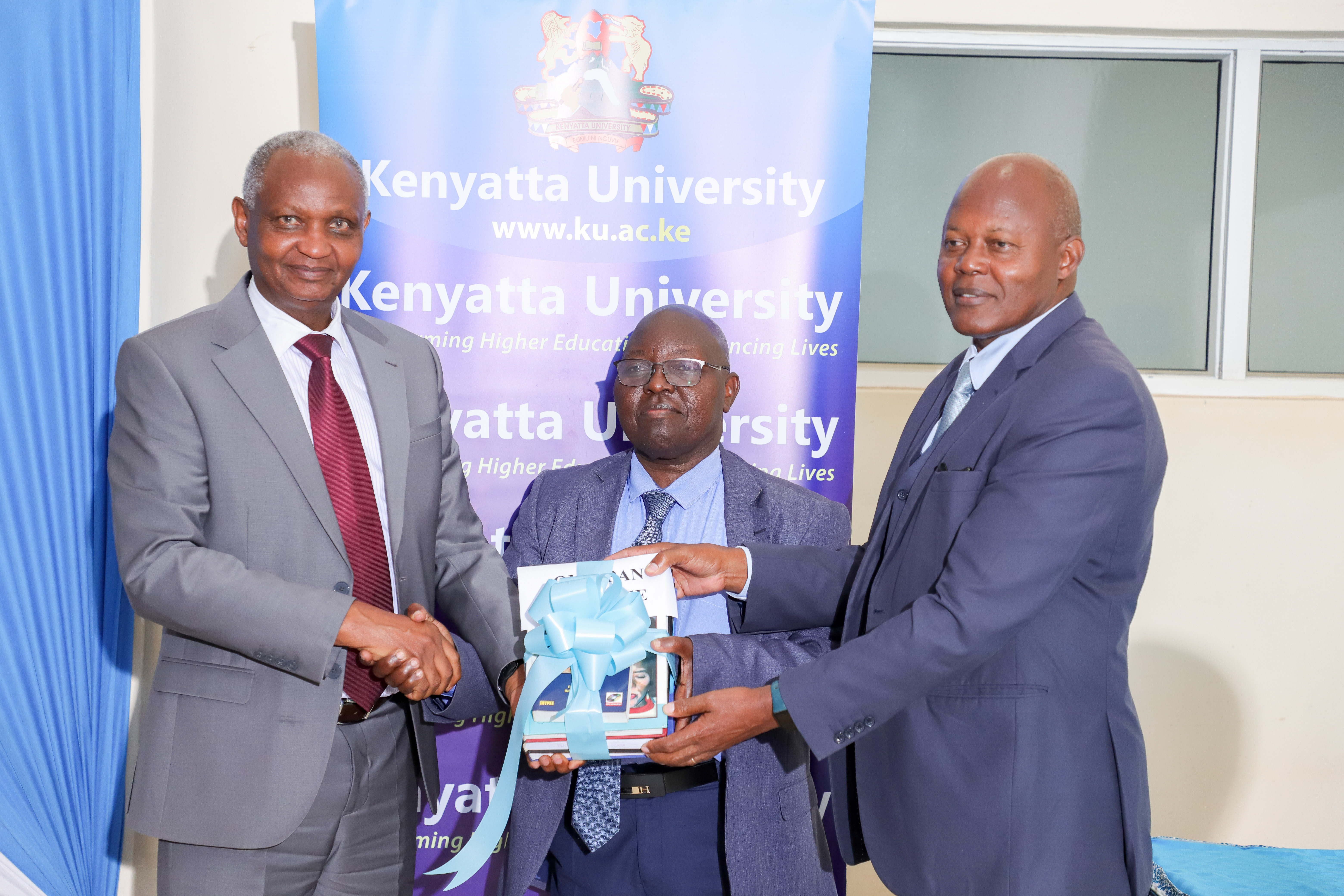 Director receiving books